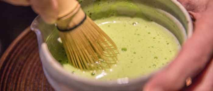 whisking ceremonial grade matcha